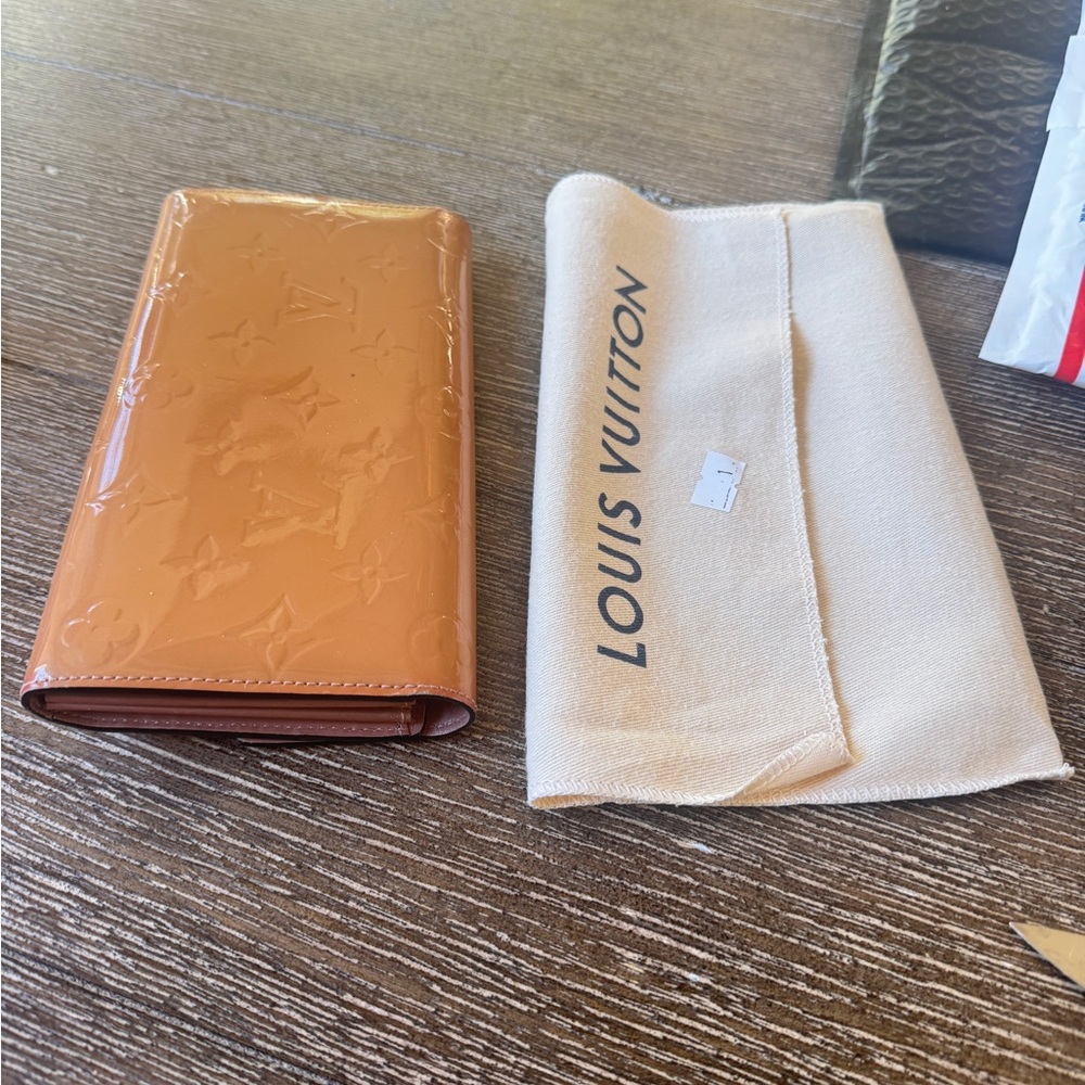 Louis Vuitton Pink Wallet with Gold Accents